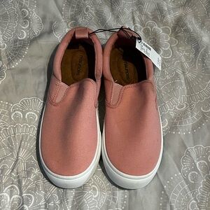 Pink slip on sneakers